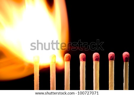  Large fire and matches on a black background. Royalty-Free Stock Photo #100727071
