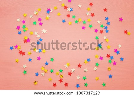 party background with colorful confetti. Top view