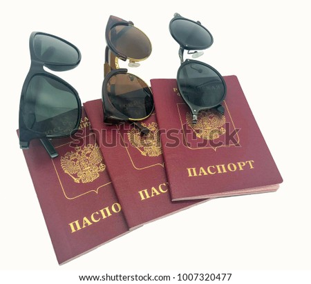 travel concept, three International Russian passports and three sunglasses. Isolated. holidays abroad