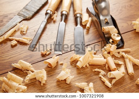 DIY concept. Woodworking and crafts tools. Carpentry hand tools. Planers, chisels, measuring tools. Wooden background. Top view Royalty-Free Stock Photo #1007321908