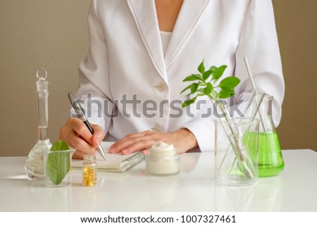 the scientist,dermatologist formulate organic natural cosmetic product in the laboratory.research and development beauty skincare .cream,serum.hand Royalty-Free Stock Photo #1007327461