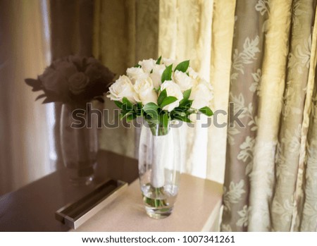 A bouquet of white roses in a vase