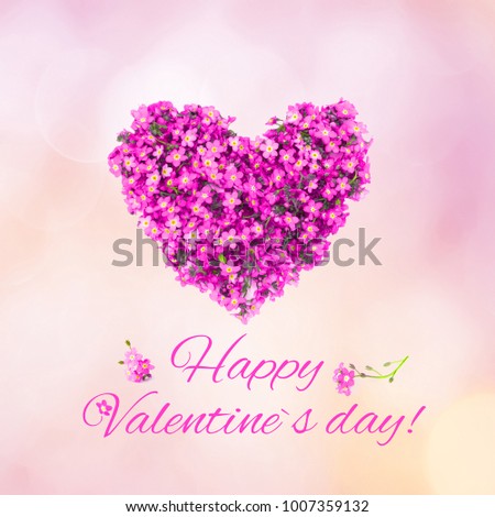 Beautiful greeting card Happy Valentines Day. Arrangement of small pink flowers in the shape of a heart on soft light pink background. Top view. Holiday Square Web banner