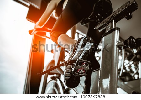 Fitness woman working out on exercise bike at the gym.exercising concept.fitness and healthy lifestyle  Royalty-Free Stock Photo #1007367838