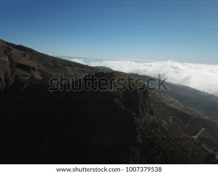 Volcano, Mountains and Clouds