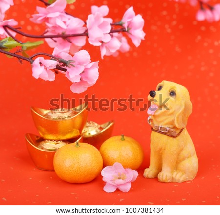 Chinese new year decoration: dog statue and gold ingots 