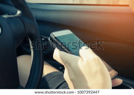 
Use a cell phone inside the car.