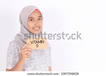 Business concept. Asian cute young women with note Vitamin D