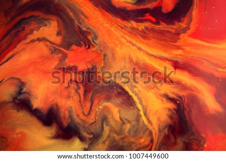 Colorful paint background in concept Fantasy luxury texture. Colors dropped into liquid and photographed while in motion. abstract composition.