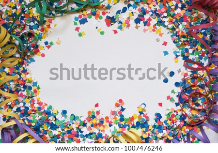 confetti and serpentine on a white background. Carnival. Abstract frame for text.