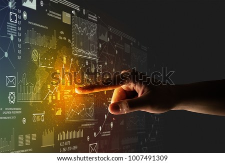 Female finger touching a beam of light surrounded by charts and graphs Royalty-Free Stock Photo #1007491309