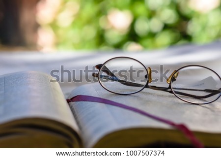 Close view of glasses on bible page