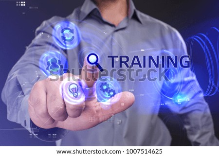 Business, Technology, Internet and network concept. Young businessman working on a virtual screen of the future and sees the inscription: Training