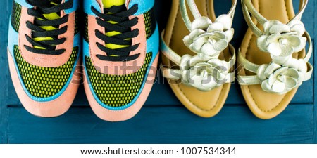 Women's sneakers and sandals on a blue background
