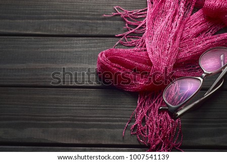 top view beauty and fashion acessories on dark texture wooden background