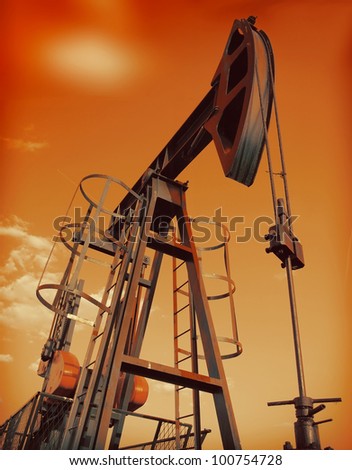 An industrial oil pump under a hot sky