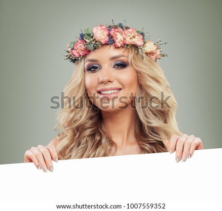 Nice Model Woman with Blank Board Banner Background. Perfect Young Woman holding White Paper Sign