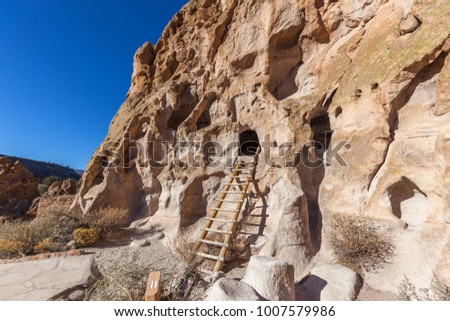 View of Bandelier National Monument near Los Alamos, New Mexico. The monument preserves the homes and territory of the Ancestral Puebloans, most of the pueblo structures dating between 1150-1600 AD. Royalty-Free Stock Photo #1007579986