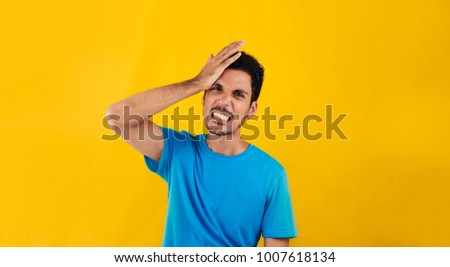 Angry man isolated on a yellow background. Concept image for social media and advertisements.