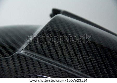 Black carbon fiber composite product close up view