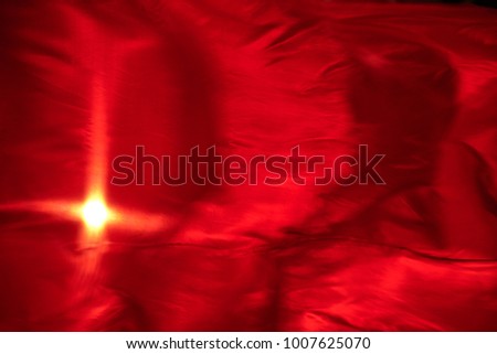 Abstract red background. Red cloth waving in the wind.
