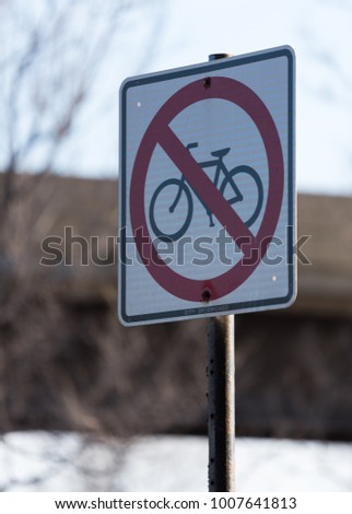 Bikes are not allowed sign on a street