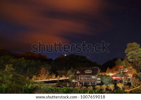 House is surrounded by mountains and many stars at E-Thong village,Thong Pha Phum National Park,Kanchanaburi province in Thailand.This is very popular for tourists.Travel and Attractions Concept