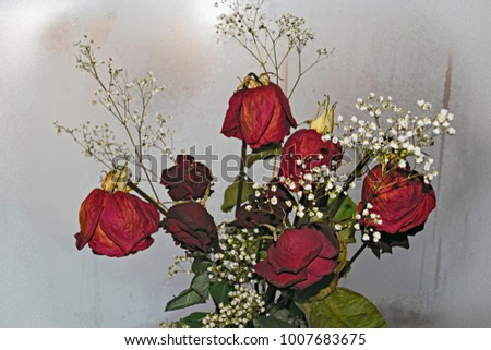 A bouquet of withered red roses