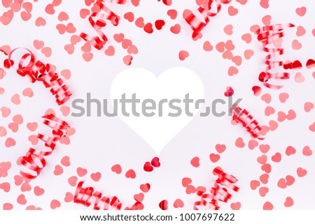 Red ribbons and glitter heart confetti. Valentine day concept. Festive flat lay design background. Horizontal, heart shape mockup