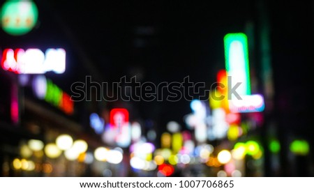 blurred background, Bokeh light,  Blurred people walking through a city street. at the night, in Seoul, Korea