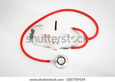 Piggy bank with stethoscope,Financial health