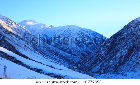 Beautiful winter landscape. Bright blue sky, snowy mountains. Winter.
