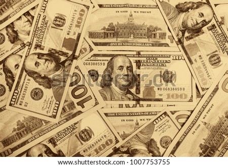 A pile of  US banknotes with president portraits. Cash of  dollar bills, dollar background image.
