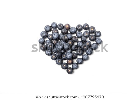 The heart shaped blueberry in the white background