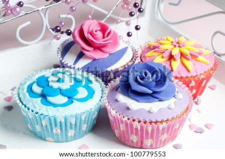 four colorful cupcake in spring style