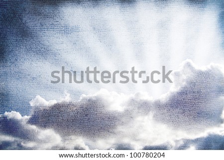 The sunbeams lighting through clouds. Old-fashioned textured effect.
