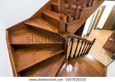 Close-up detail of brown wooden stairs Royalty-Free Stock Photo #1007838310