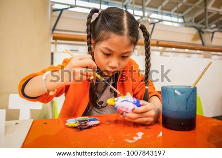 little girl color plaster doll