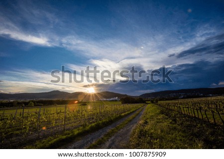 sunset behind hills over the valley 