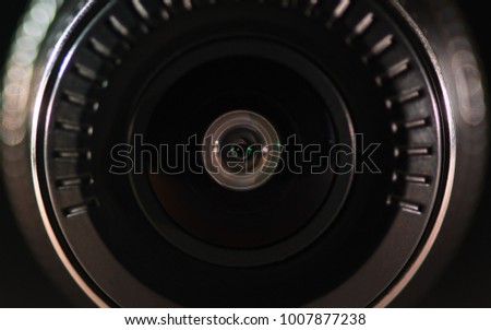 The camera lens with colored light, close photos, close up. Optics.
