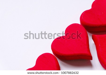 Top view of red wooden handcraft heart symbol with copy space for text or logo on white background.  Valentine's day theme.