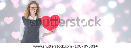 Digital composite of Valentines lady holding heart with love hearts background
