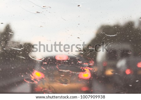 Car driving in a rain storm background.traffic jam