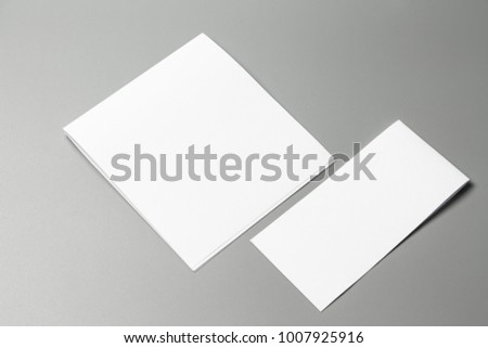 Blank portrait Mock-up paper. changeable background / white paper isolated on gray. identity design, corporate templates, company style, set of booklets, blank white folding paper flyer