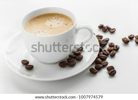 a cup of black coffee in a white cup