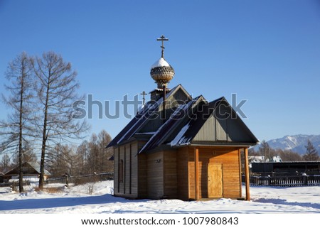 A small church in russian village Zamulta in winter in Uimon Valley, Altai mountains.
