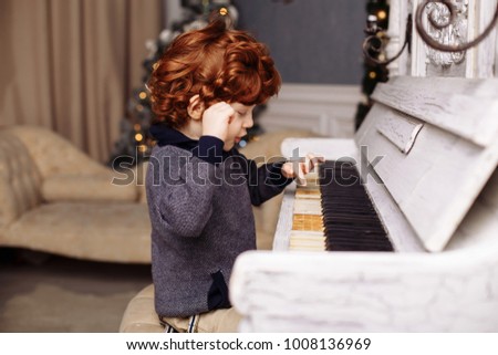 beautiful boy and girl playing the piano
