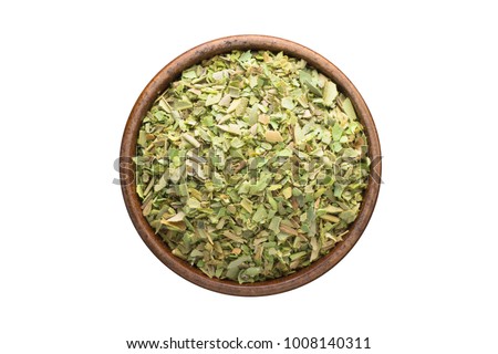 dried oregano seasoning in a wooden bowl, top view. spice isolated on white Royalty-Free Stock Photo #1008140311