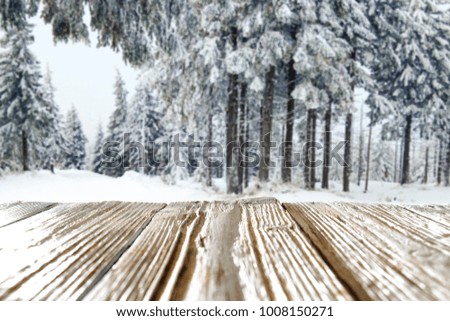 Desk of free space and landscape of winter forest 