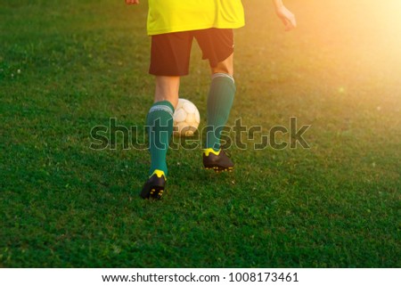 to play football. at the stadium with green grass. soccer ball